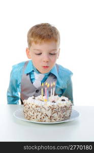 Beautiful little boy celebrates birthday. Isolated on white background