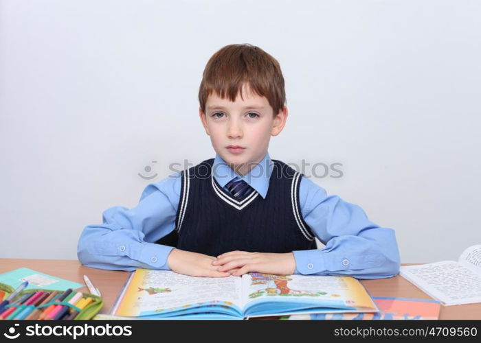 beautiful little boy sitting at the table