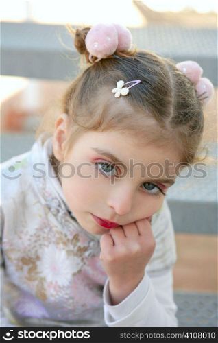 Beautiful little caucasian toddler girl with asian costume and makeup