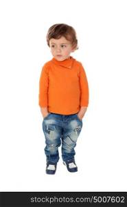 Beautiful little child two years old wearing jeans and orange jersey isolated on white background