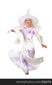 Beautiful Little Girl in a Costum of White Witch is Dancing with a Magic Wand at the Halloween or Carnival Party