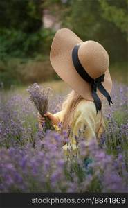 Beautiful little girl on lavender field. Sunset. 