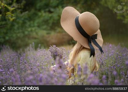 Beautiful little girl on lavender field. Sunset. 