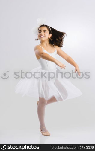 Beautiful little girl practicing ballet