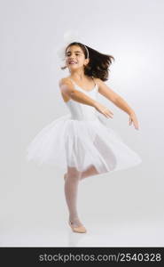 Beautiful little girl practicing ballet