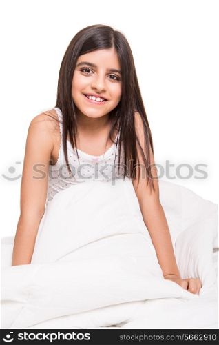 Beautiful little girl relaxing on her bed