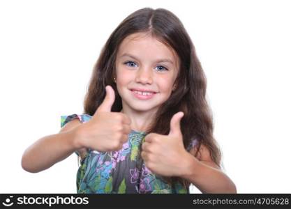 Beautiful little girl shows finger as sign that everything is fine
