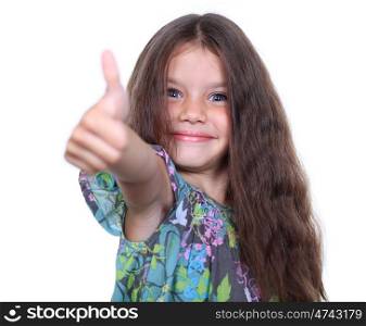 Beautiful little girl shows finger as sign that everything is fine