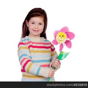Beautiful little girl with a pinwheel isolated on a white background
