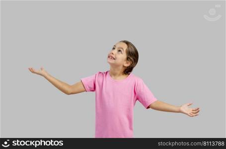 Beautiful little girl with arms open, with copy space