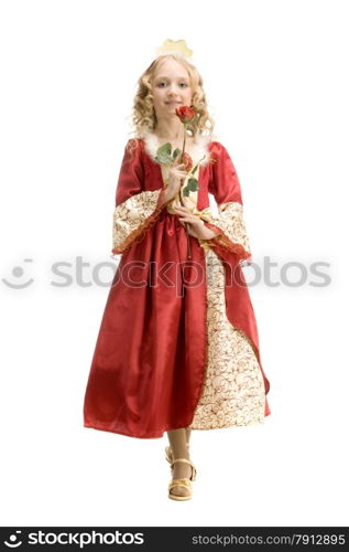 Beautiful little girl with long blonde hair in the princess costume holding a red rose at the white background. Red and gold empire dress