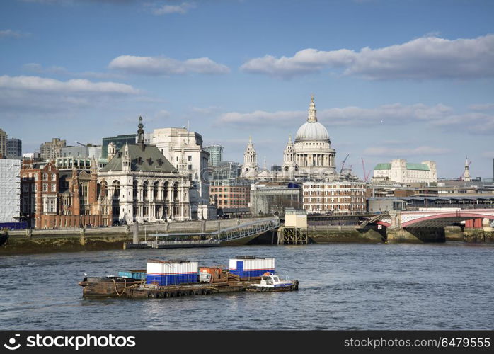 Beautiful London city skyline landscape on blue sky Summer day a. England, London, City of London. The River Thames and London city skyline including St Pauls Cathedral.. Beautiful London city skyline landscape on blue sky Summer day