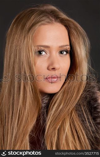 beautiful long-haired girl on a black background