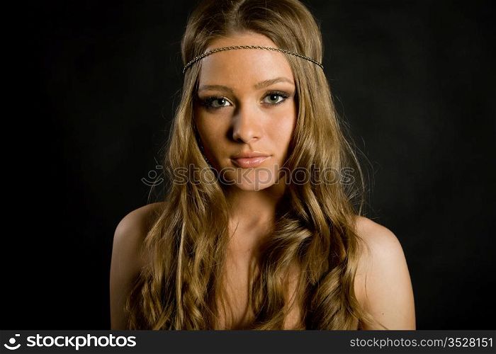 beautiful long-haired girl on a black background
