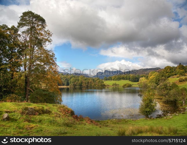 Beautiful Loughrigg Tarn in late summer, Cumbria, England.