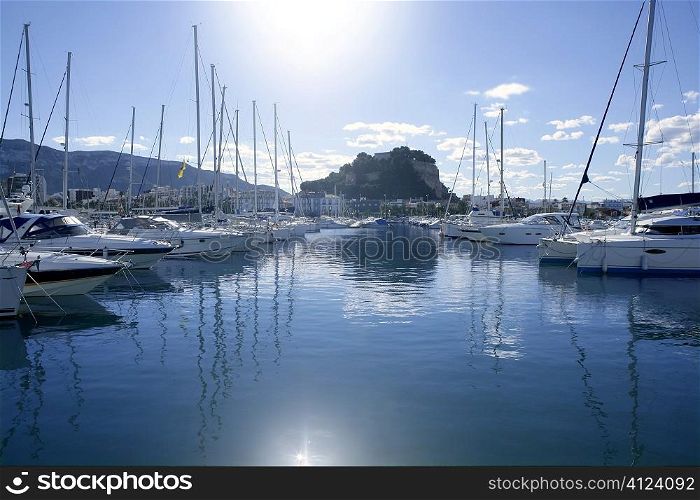 Beautiful marina view, sailboats and motorboats in blue water