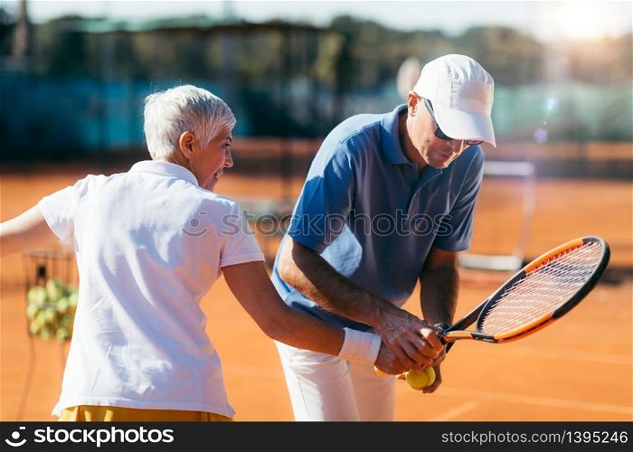 Beautiful Mature Active Woman Playing Tennis