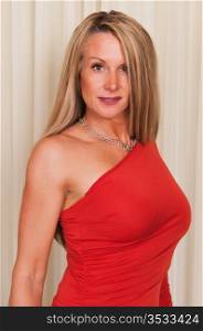 Beautiful mature blonde in a red dress