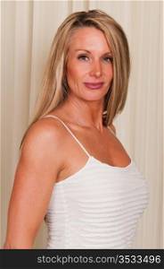 Beautiful mature blonde in a white blouse