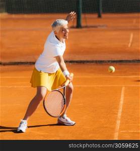 Beautiful Mature Woman at the Tennis Court