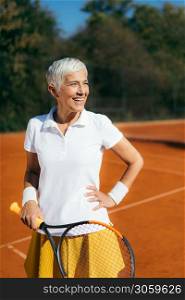 Beautiful Mature Woman at the Tennis Court
