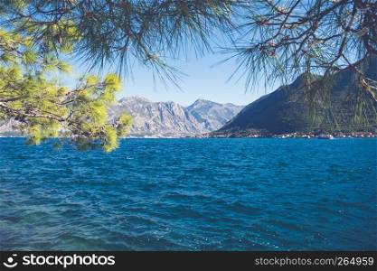 Beautiful Mediterranean landscape, mountains, sea and boat on the water. Montenegro, Adriatic Sea, Bay of Kotor