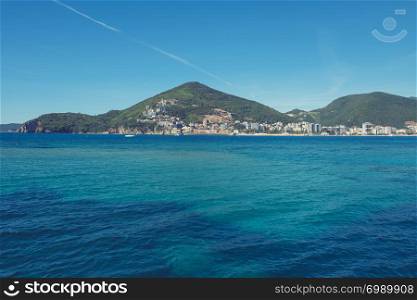 Beautiful Mediterranean landscape, mountains, sea and boat on the water. Montenegro, Adriatic Sea, Bay of Kotor