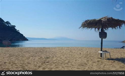 Beautiful Micros Aselinos beach on Skiathos island in Greece, umbrella, summer day in June