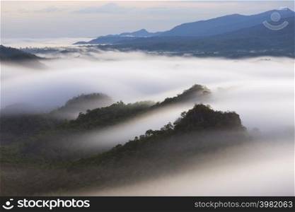 Beautiful mist over green forest on mountain, Aerial view sunrise over the mountain range at the north of thailand, Beauty rainforest landscape with fog in morning.. Beautiful mist over green forest on mountain.