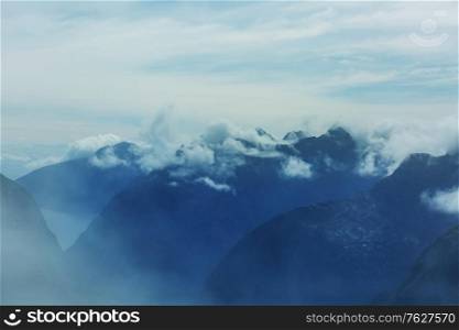 Beautiful misty mountains in Fiordland National Park in south island, New Zealand