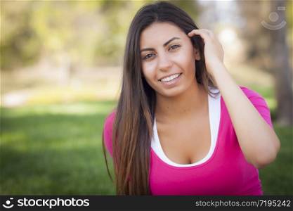 Beautiful Mixed Race Young Woman Portrait Outside In The Grass.