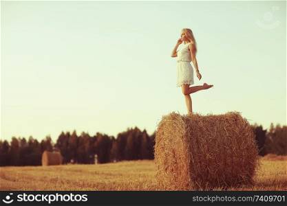 beautiful model posing outdoor nature / adult girl model outdoor nature, happy woman in a summer landscape field