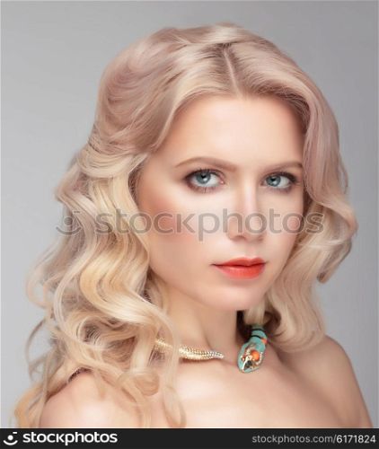 Beautiful model with natural make up and blonde hair. Close portrait.