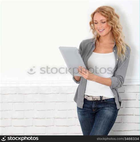 Beautiful modern woman using digital tablet