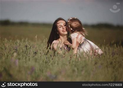 Beautiful Mother And her little daughter outdoors. Nature. Beauty Mum and her Child playing in Park together. Outdoor Portrait of happy family. Happy Mother&rsquo;s Day Joy. Mom and Baby. Beautiful Mother And her little daughter outdoors. Nature. Outdoor Portrait of happy family. Beauty Mum and her Child playing in Park together. Happy Mother&rsquo;s Day Joy. Mom and Baby