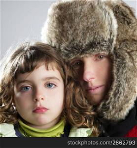 beautiful mother daughter winter portrait fur hat