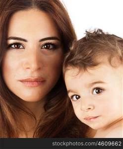 Beautiful mother holding baby boy, mom carry cute child adorable small son, happy family closeup picture, mom and kid modeling indoor, healthy toddler and mommy, brunette Arabic models, happiness