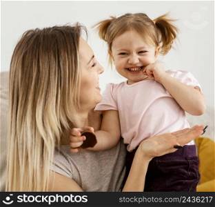 beautiful mother spending time together with her daughter home
