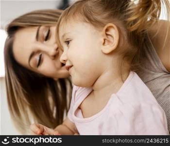 beautiful mother spending time together with her daughter home 5
