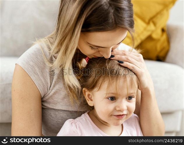 beautiful mother taking care her daughter 3