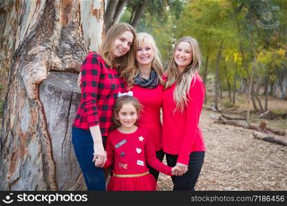 Beautiful Mother With Young Adult Daughters and Mixed Race Granddaughter Portrait Outdoors.