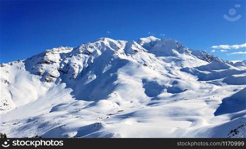 beautiful mountain in snow under blue sky