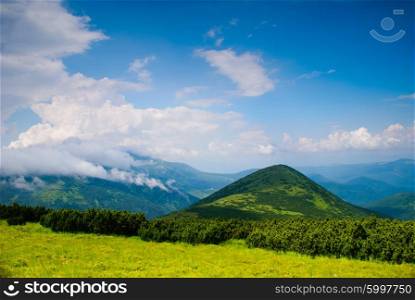 Beautiful mountain landscape. Beautiful blue sky and glade high up in Carpathian mountains