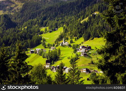 beautiful mountain landscape. view of a small Italian village located on the slope of the mountains. Dolomites, Italy