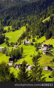 beautiful mountain landscape. view of a small Italian village located on the slope of the mountains. Dolomites, Italy