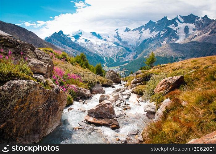 Beautiful mountain landscape with stream near Alps, Switzerland in the summer Swiss Europe. Beautiful mountain landscape with stream near Alps, Switzerland in the summer in blue sky