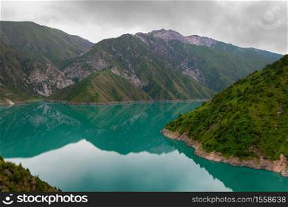 Beautiful mountain turquoise color lake Karasuu in Tian-Shan, Kyrgyzstan.. Beautiful mountain turquoise color lake Karasuu. Kyrgyzstan.