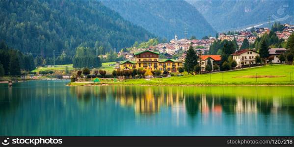 Beautiful mountain village landscape of Villapiccola and Lake Auronzo in Auronzo di Cadore, northern Italy. Nature and countryside panoramic landscape.