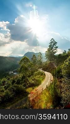 Beautiful mountains landscape and road with blue sky and sunlight