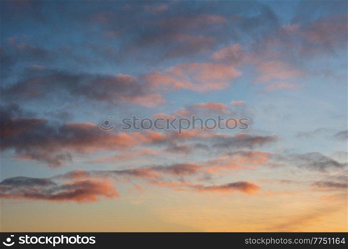 Beautiful multi colored sunset landscape image with vibrant tones for use as background or in composite images